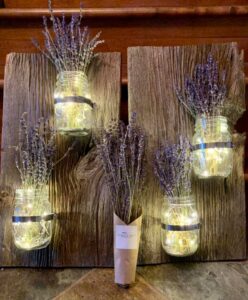 Barn board holding mason jars of lavender and lighs product by EdgeWorks Creations